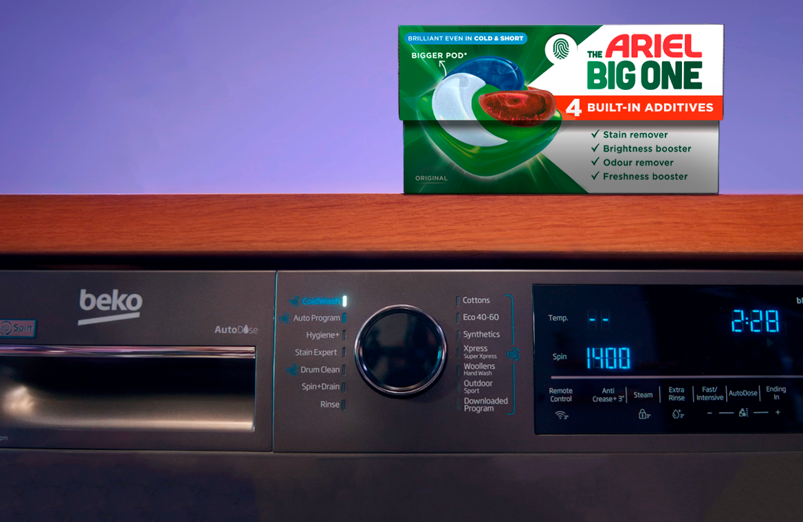 A box of Arial The Big One on top of a grey Beko washing machine