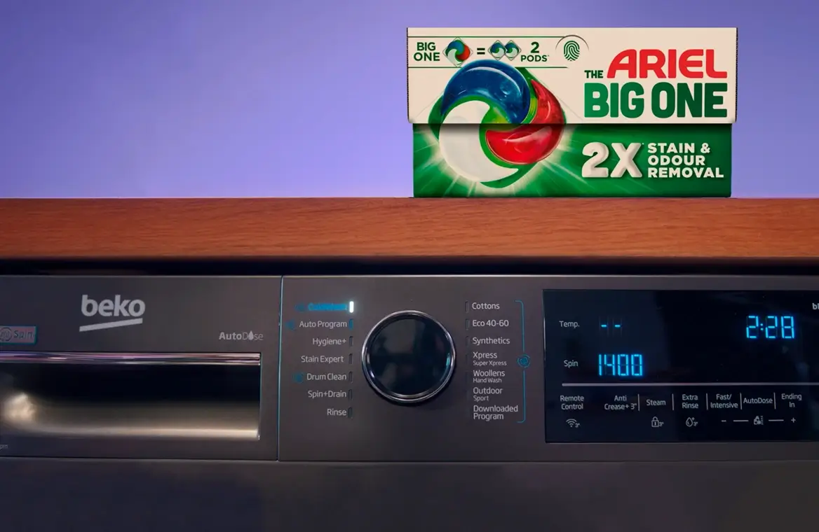 A box of Arial The Big One on top of a grey Beko washing machine
