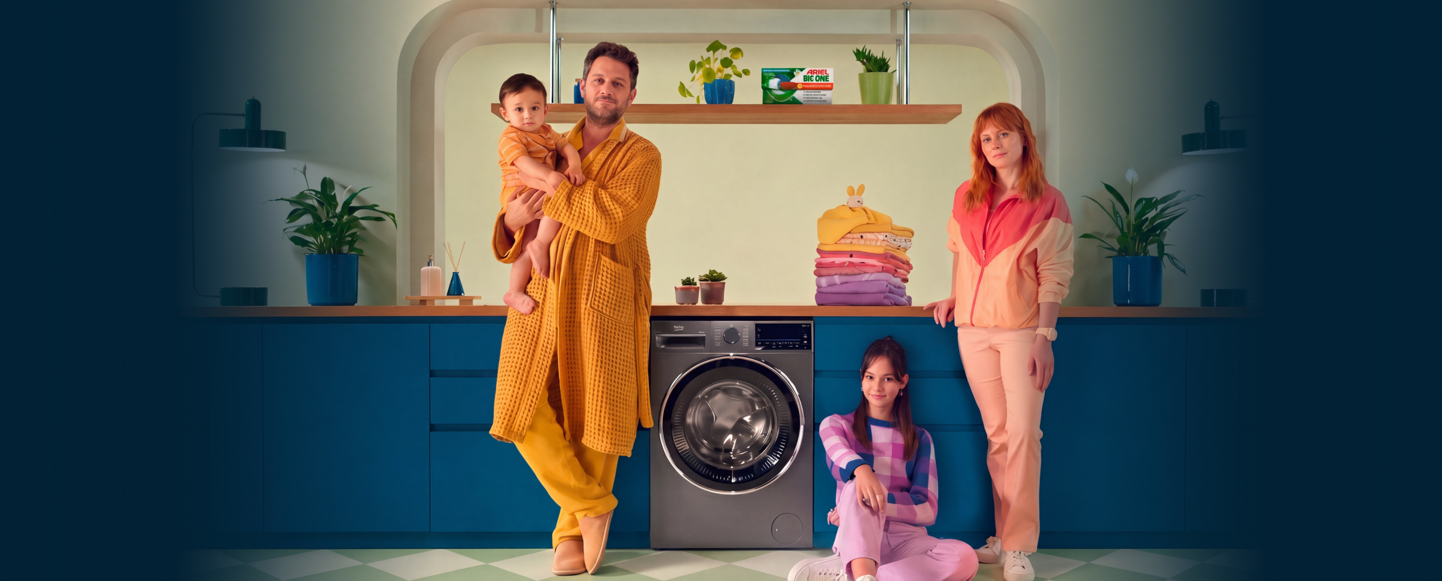 A photo of a family by a Beko washing machine