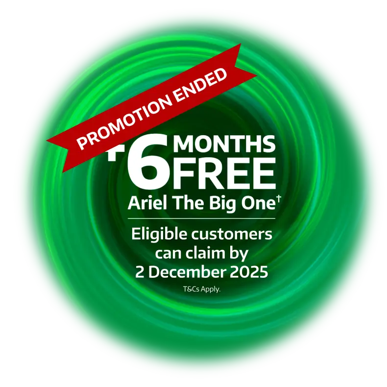 A young child playing in a laundry basket, plus 6 months free Ariel The Big One (T&Cs apply) when you buy any Beko EnergySpin Washing Machine or Washer Dryer