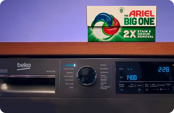 A box of Arial The Big One on top of a grey Beko washing machine