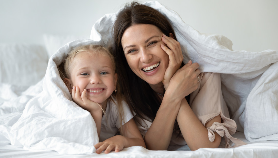 Family with bedsheets