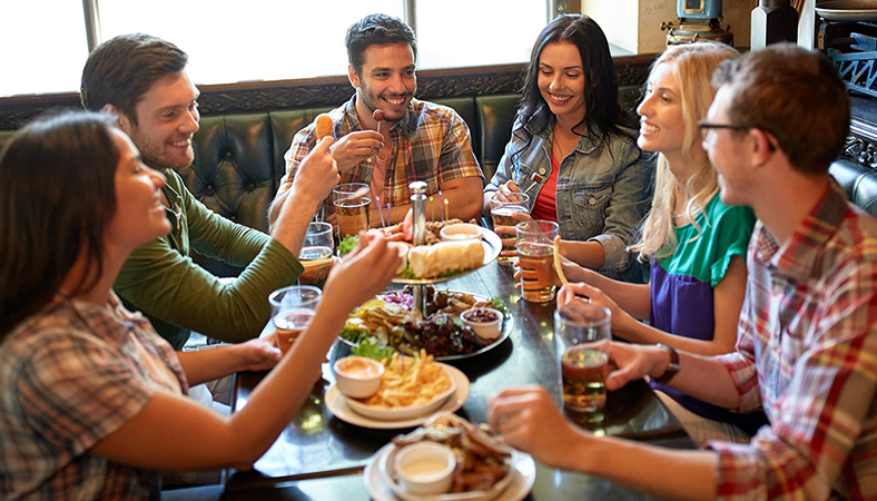 group-of-friends-socialising-at-pub